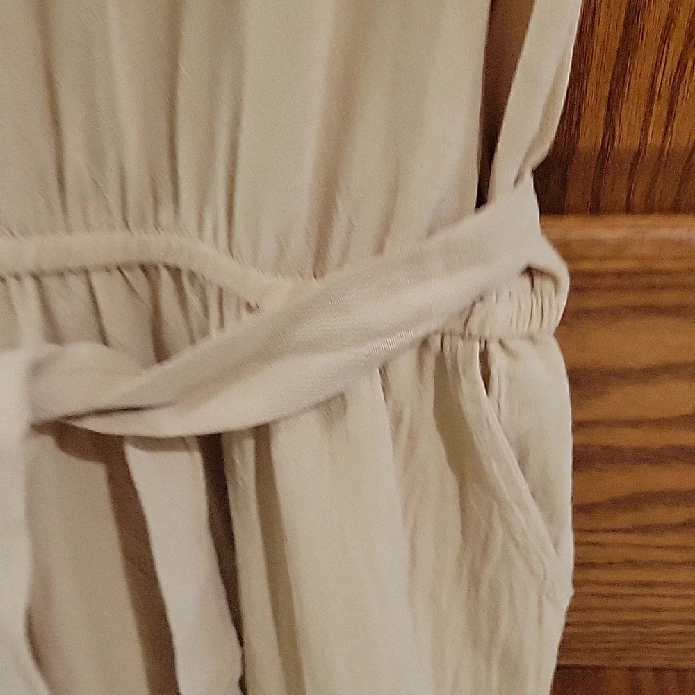 This is a womens linen jumpsuit in a tan color, size large. - Picture 3 of 4